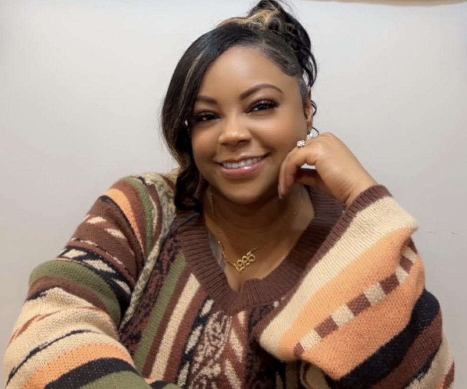 Miss Shay smiling warmly